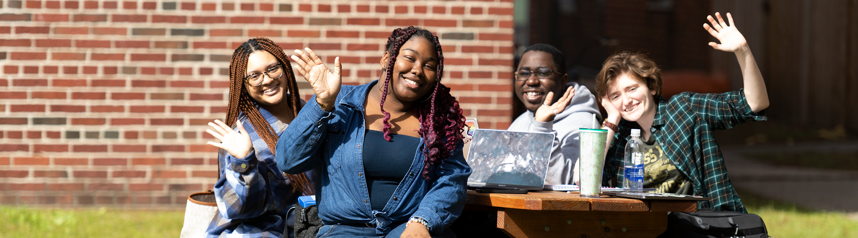 Four Loyola Students at Table