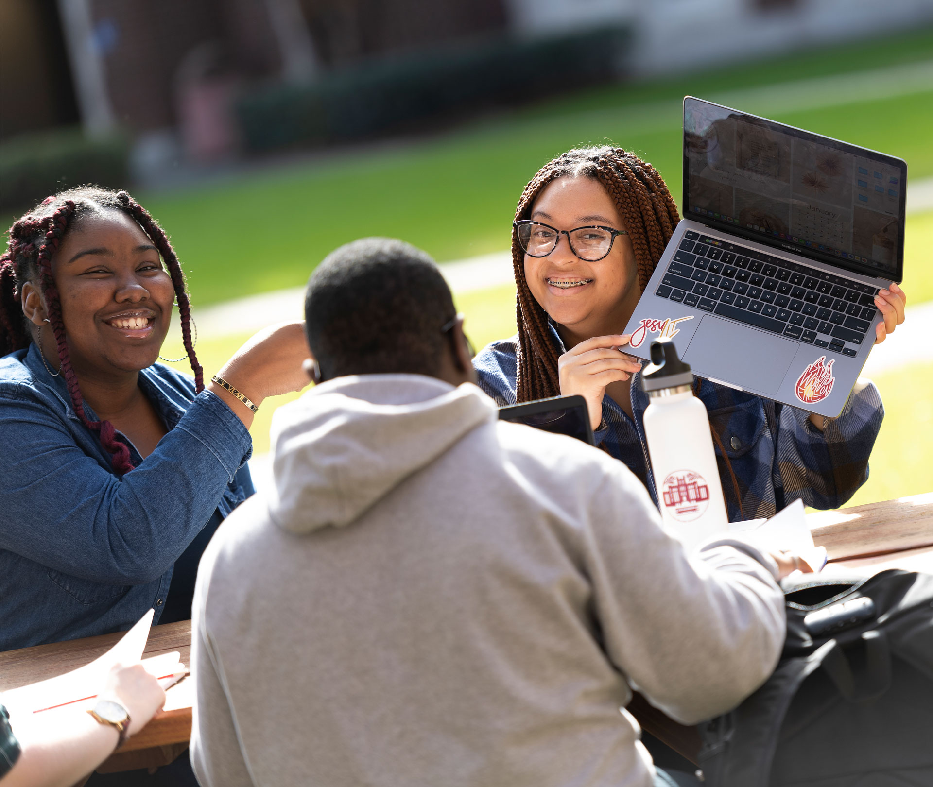 Loyola Student with Laptop